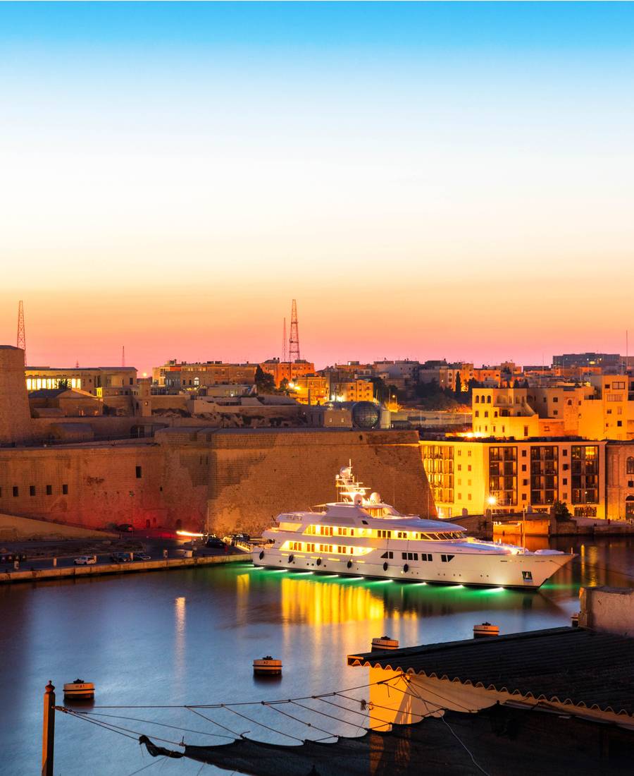 Lit Up Superyacht In Malta Harbour At Dusk | Praxis